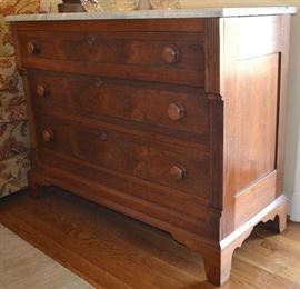 Lot 434: Victorian marble top walnut chest of 3 drawers with wooden pulls, bracket base, with dovetailed drawers with figured wood accents; 33"h x 41"w x 18"d, refinished (77)
