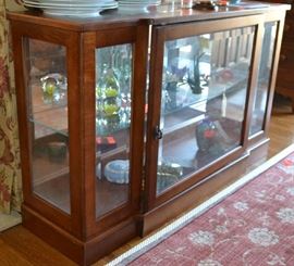 Lot 436: Cherry finish glass and wood console display cabinet with glass shelves and mirror back; 29"h x 48"w x 13"d, lighted (37)
