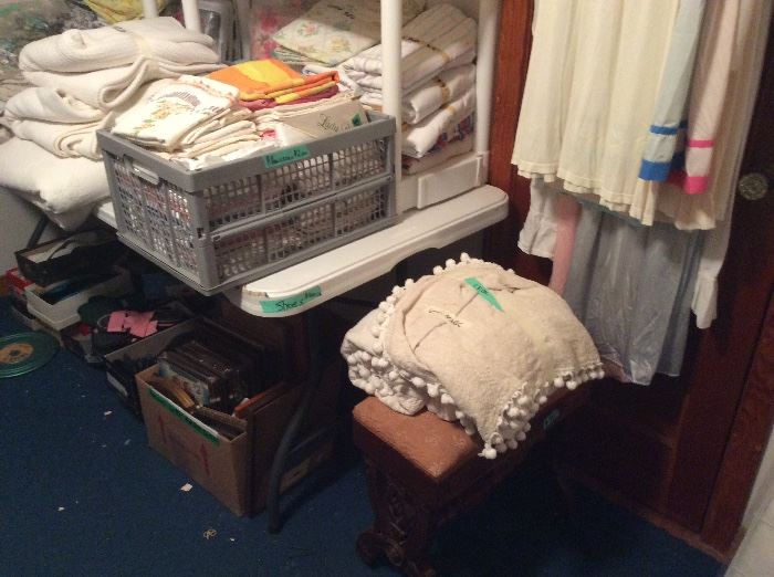 Vintage stool, vintage chenille full bedspread, bin full of pillowcases 