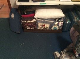 Lots of decorative pillows, vintage suitcases & vacuum with all attachments