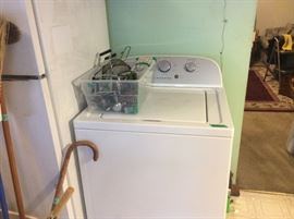 Washer and basket of various kitchen utensils