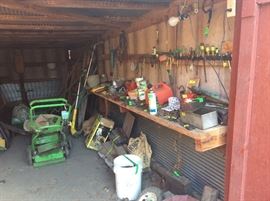 Boat Shed - miscellaneous tools, oils, tires, cans, wheel barrow, blowers, trimmers, electrical cords, push mower.