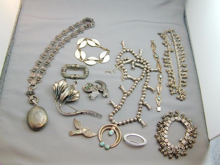 Assorted silver & sterling jewelry to include Victorian locket & chain, Meka Guilloche enamel bracelet and silver Native American Squash Blossom necklace with Turquoise.
