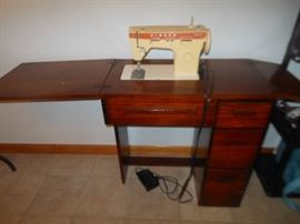 Singer sewing machine and cabinet