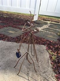 Fun and quirky praying mantis yard art.