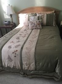 Full size bed and gorgeous bedding set.