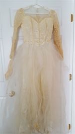 Tulle and lace 1952 long sleeve wedding gown.