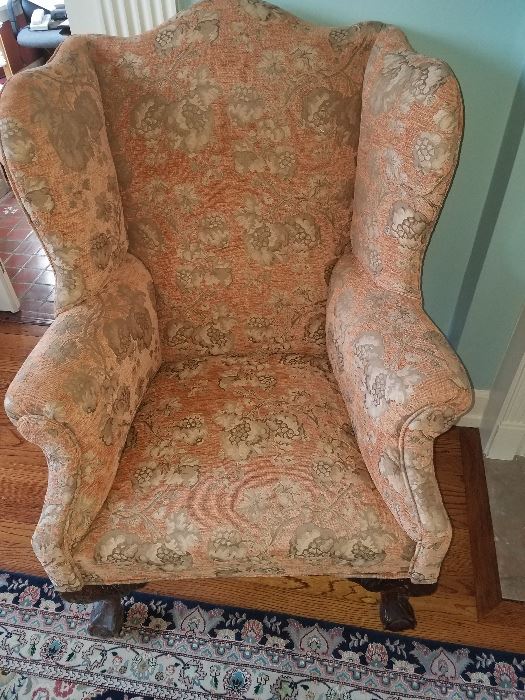 Recently recoveredball and claw foot wing back chair