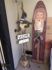 the santa is folk art painted on an old ironing board