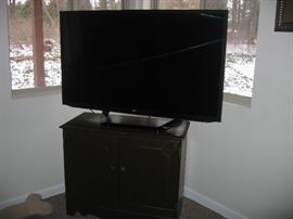 55" 3D flat screen TV (3 years old) with 4 pair 3-D glasses and cabinet.