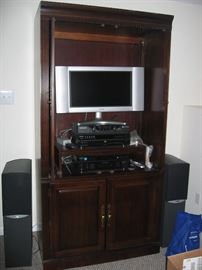 Third cabinet to match 2 in prior photo with stereo equipment and speakers