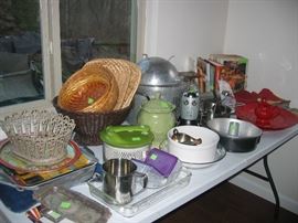 Kitchen serving pieces, baskets, pots, trays, cookbooks, small appliances
