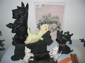 Collection of antique and new door stops, boot scraper, card holder, etc.