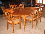 Knotty pine dining room table and chairs.