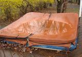 Jacuzzi hot tub and cover.