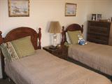 Twin beds with matching bedroom furniture.