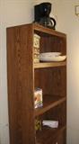 Bookcase/shelving unit with coffee maker.
