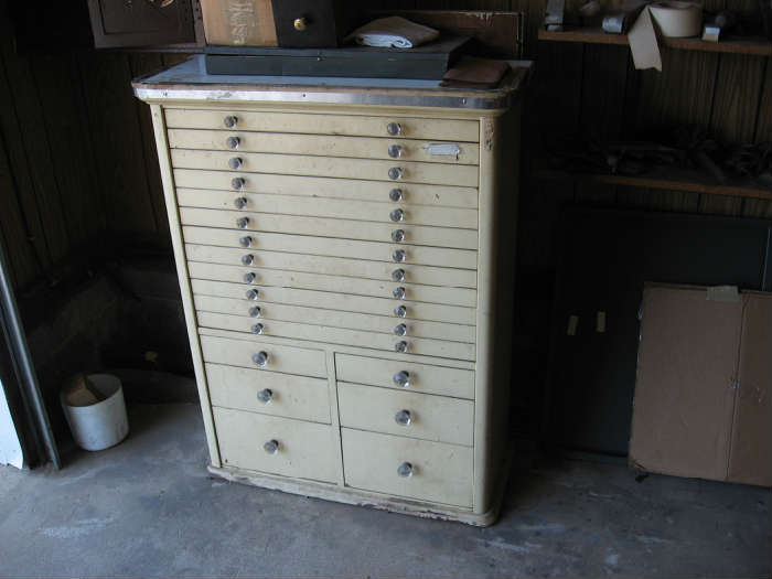 Antique dental cabinet with original glass knobs.