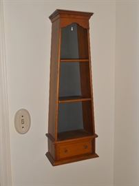 Unusually shaped wall shelf