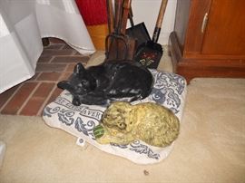 Resting and playful cat figures