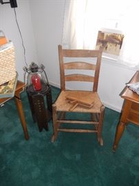 Small vintage rocker with set of wool carders on seat