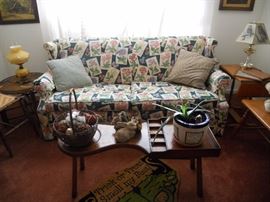 One of 2 Early American style sofas and cobbler's bench/coffee table 