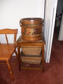 Sugar bucket sitting on small side piece with 2 storage baskets