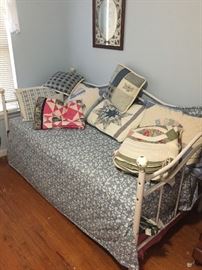 Trundle day bed. Another bed is underneath. just pull is out and raise it up and you have another bed.