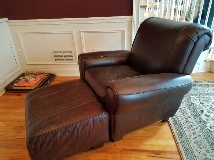 Leather chair and ottoman, one of a pair