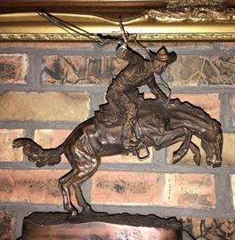 The Bronco Buster bronze figurine by Frederick Remington