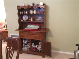 Wooden hutch with collectibles & Christmas items. 
