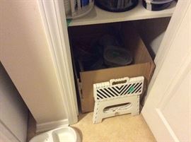 box of plastic items, dog bowl, portable stool