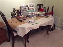 Oval table with 4 chairs, set of dishes - Dancing Elmo in background