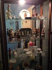 large curio cabinet with collectibles