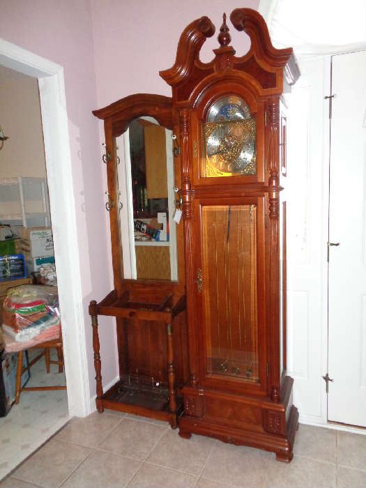 vintage hall tree and a grandfather clock