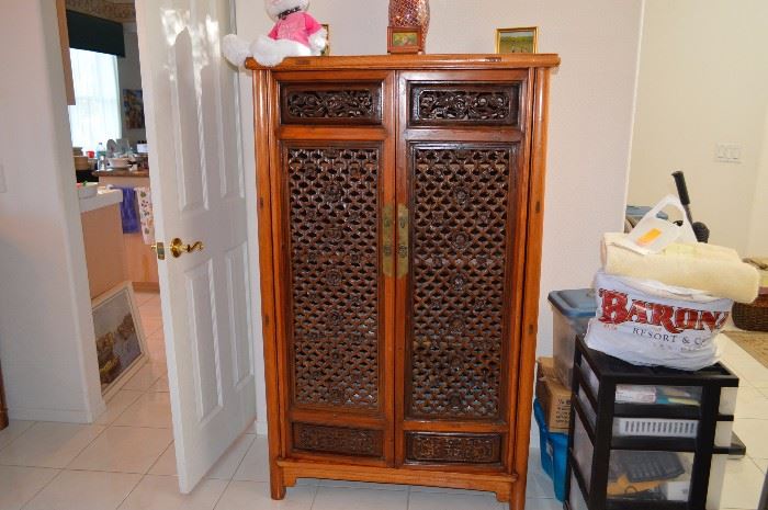 Carved asian cabinet