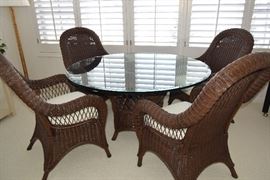 Glass top wicker pedastool table with four chairs