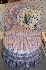 Small purple upholstered chair with matching ottoman