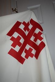 Cape/Robe from The Equestrian Order of the Holy Sepulchre. The Equestrian Order of the Holy Sepulchre of Jerusalem (EOHSJ) is a nine-hundred-year-old organization with a mission of critical need today: to help preserve Christianity in the Holy Land. It is a lay order under the protection of the Holy See with members worldwide who actively support the Latin Patriarch (the Archbishop of Jerusalem) with prayers, donations and a presence through pilgrimages. Practicing Catholics who actively support their diocese and parish may be nominated to be members of the Order.