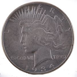 1934 Peace Dollar: A 1934 Peace dollar. Designer: Anthony de Francisci. Diameter: 38.10 mm. Weight: 26.73 grams. Mintage: 954,057. Metal Content: 90% silver 10% copper.