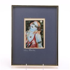 Louis Recchia Offset Lithograph "The Pendant": An offset lithograph after an original 1981 painting titled The Pendant by Denver artist Louis Recchia. It depicts a woman in the style of a 1920s flapper, her head tilted to one side with her eyes closed, a deep red rose in her hair, wearing a heart-shaped pendant. This work is presented with a double mat of blue and white under glass, in a gold toned metal frame wired for hanging. A card with artist attribution is attached on verso, and his name is hand written in white chalk on the front mat opening.