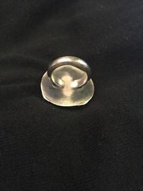 A large quartz ring from "The Berkley" Collection from Grimballs Jewelry "Bold Ring with Large Round Faceted Rutilated Quartz in 18ky bezel with sterling silver shank" size 7/7.5