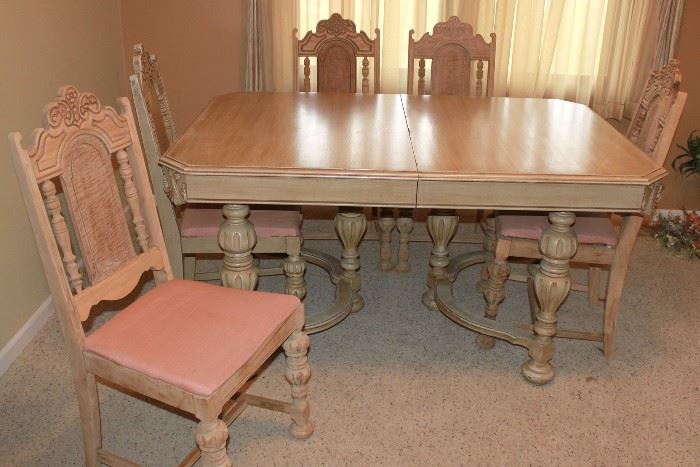 Partially finished antique dining room table and five chairs. 
