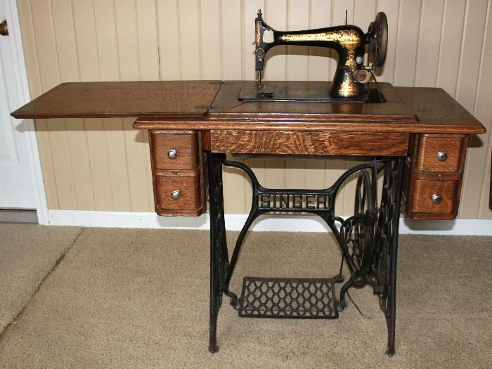 Antique Singer sewing machine with cabinet