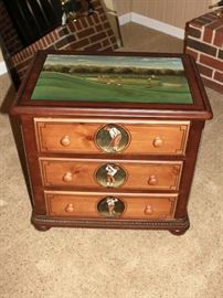 Small chest with golf motif. 