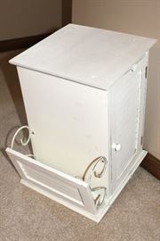 Small white cabinet with magazine rack