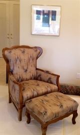 Wood-framed arm chair with tan & black cushions and ottoman