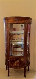 Antique curio cabinet features detailed painting on the bottom
