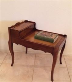 Small French Provincial leathertop end table with top storage