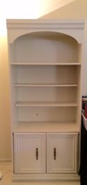 White bookshelf with storage doors